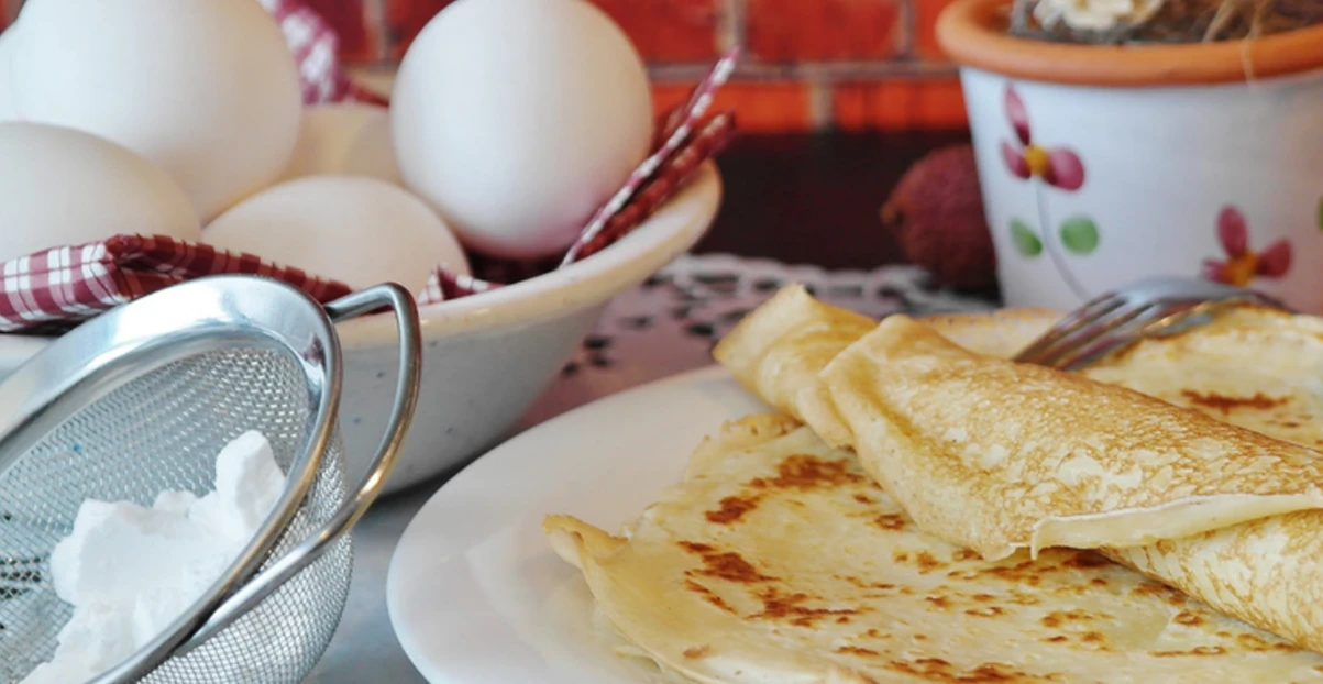 eggs and crepes on a table