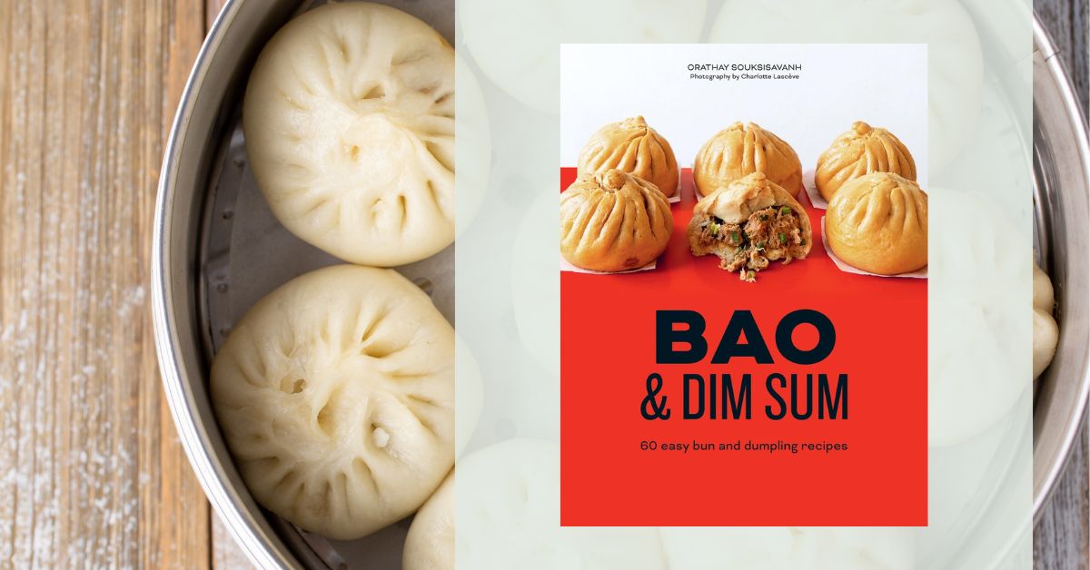 Bao buns in a steamer with the bao cookbook.