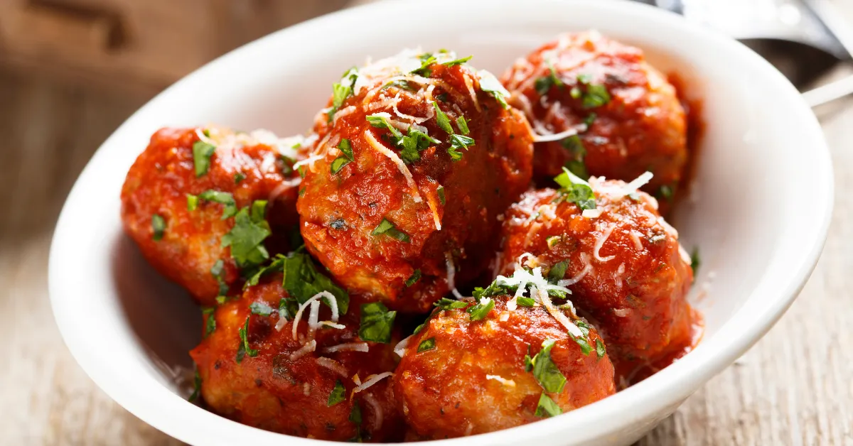 meatballs with red sauce in a bowl