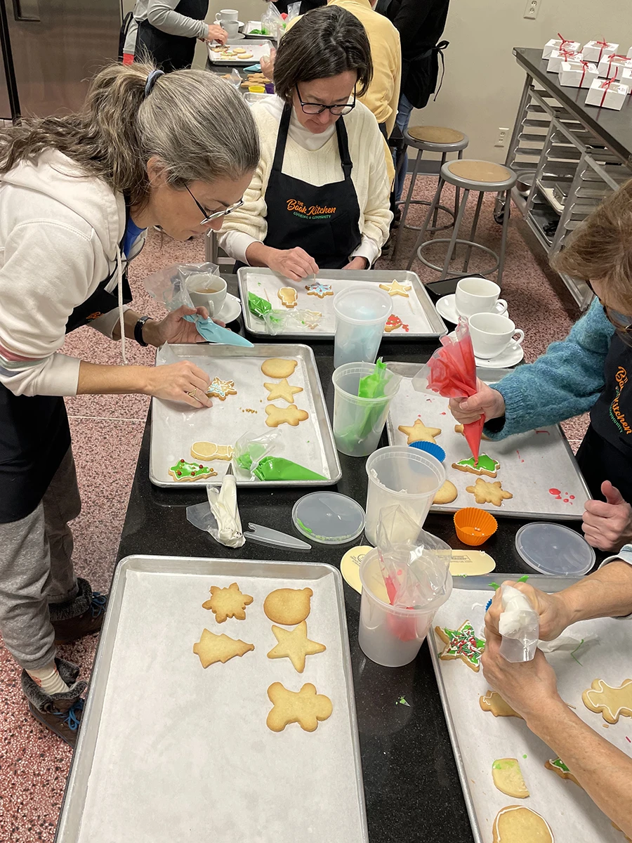 women decorating cookies