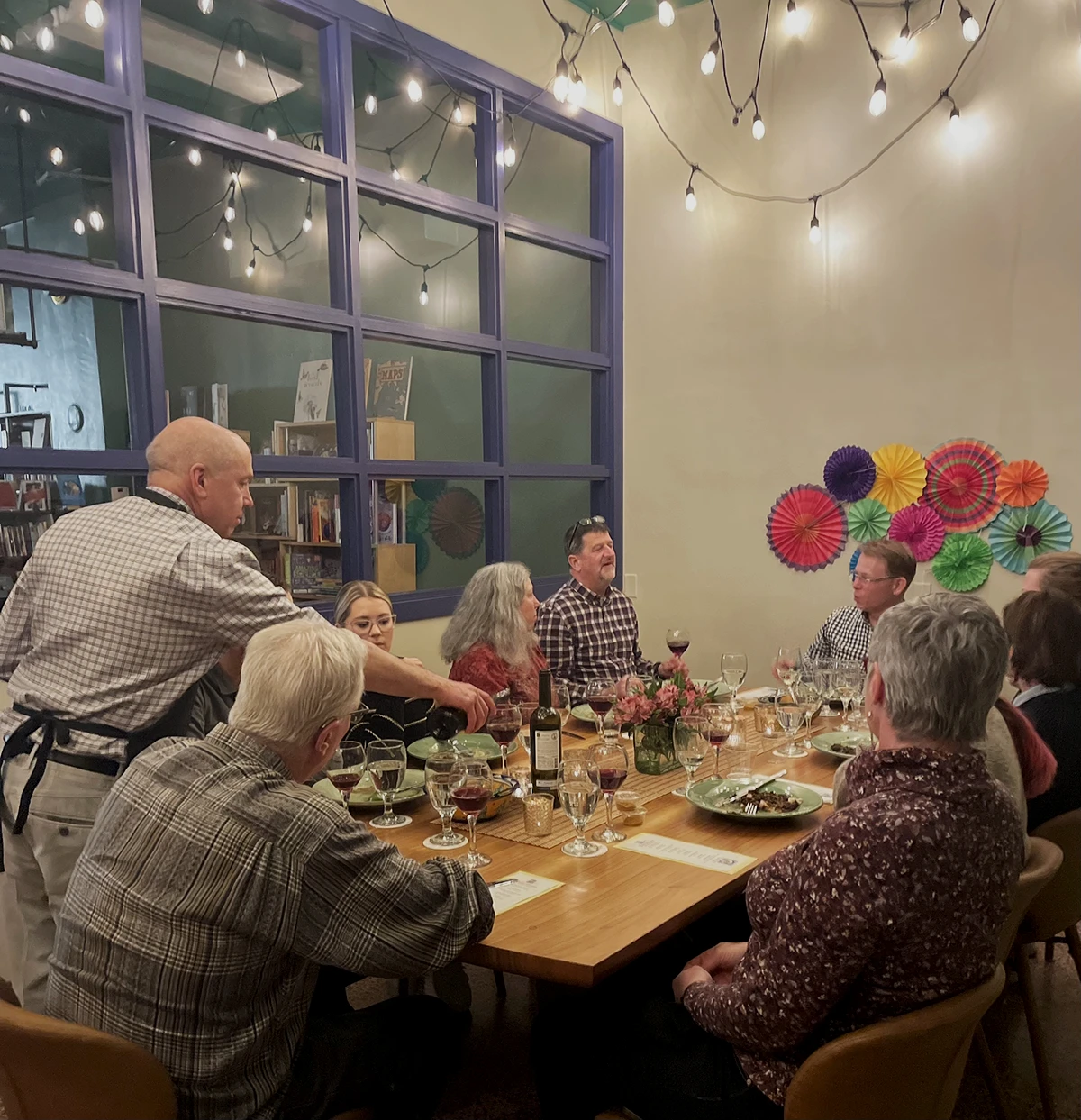 A table full of guests being served a meal.