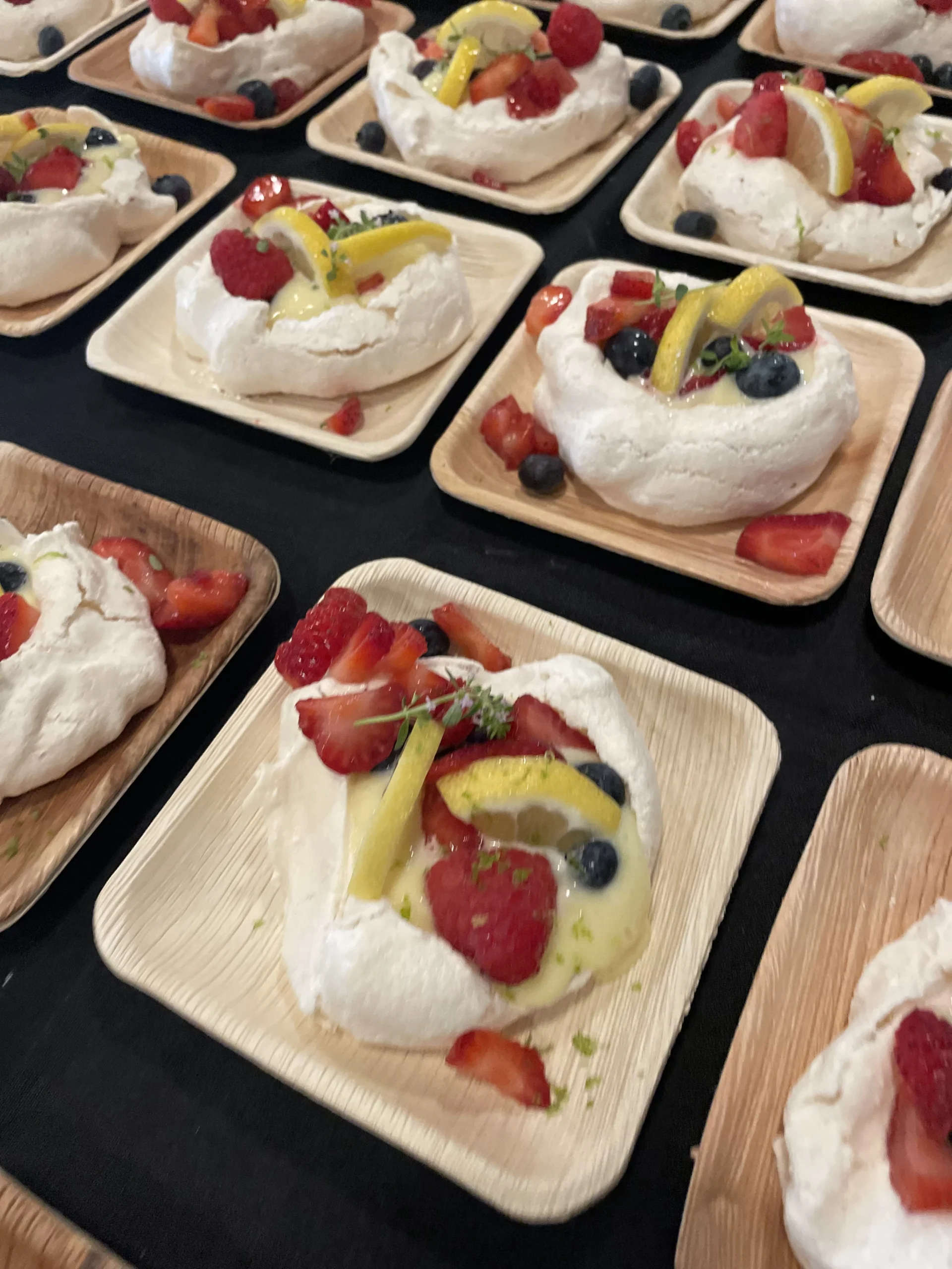 a table full of meringue desserts at a bridal shower